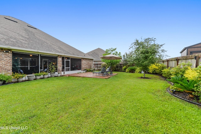view of yard with a patio and a sunroom