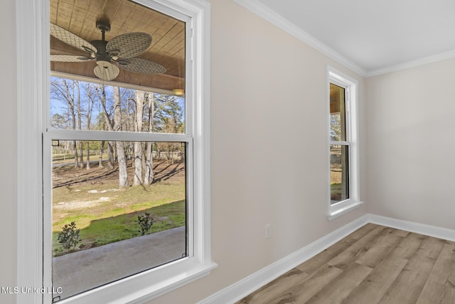 interior details with a ceiling fan, baseboards, ornamental molding, and wood finished floors