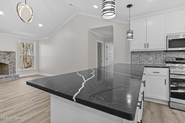 kitchen featuring electric range, white cabinets, decorative backsplash, ornamental molding, and light wood-style floors