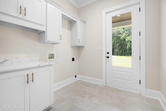 563 Valentine Rd, Holly Springs, MS 38635 - laundry room with cabinet space, hookup for a washing machine, and hookup for an electric dryer