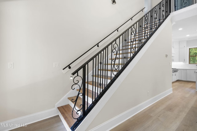 563 Valentine Rd, Holly Springs, MS 38635 - stairway featuring wood finished floors and recessed lighting