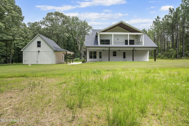 563 Valentine Rd, Holly Springs, MS 38635 - rear view of house with a ceiling fan and a yard