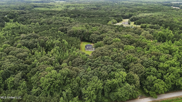563 Valentine Rd, Holly Springs, MS 38635 - drone / aerial view of a heavily wooded area