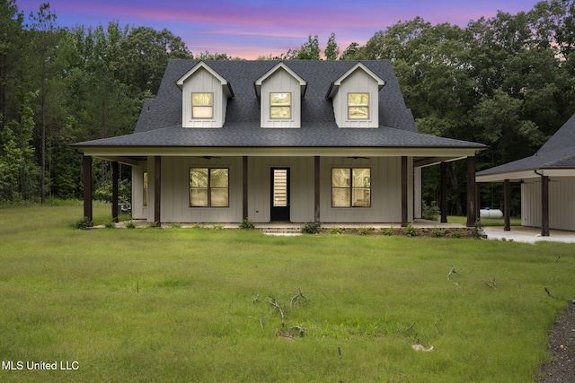 563 Valentine Rd, Holly Springs, MS 38635 - view of front of house with a lawn, a porch, board and batten siding, and a shingled roof