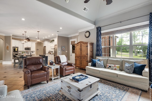 living area featuring recessed lighting, arched walkways, ceiling fan, crown molding, and baseboards