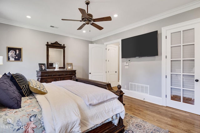 bedroom featuring wood finished floors, recessed lighting, ornamental molding, a ceiling fan, and baseboards