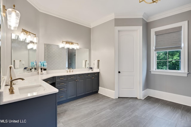 full bathroom featuring double vanity, ornamental molding, and baseboards