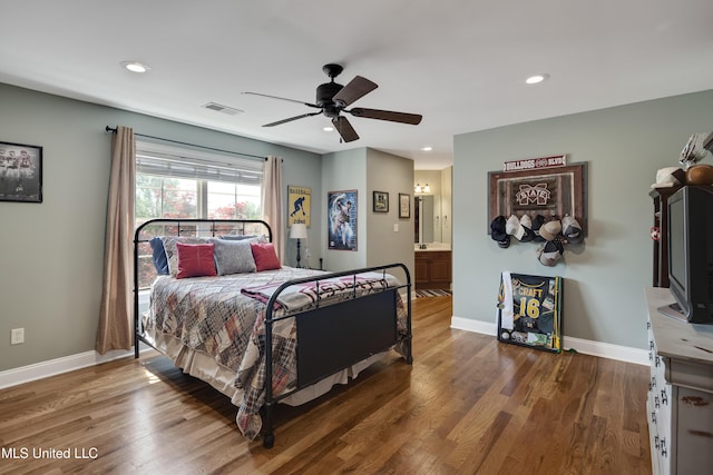 bedroom featuring baseboards, wood finished floors, recessed lighting, a ceiling fan, and ensuite bathroom