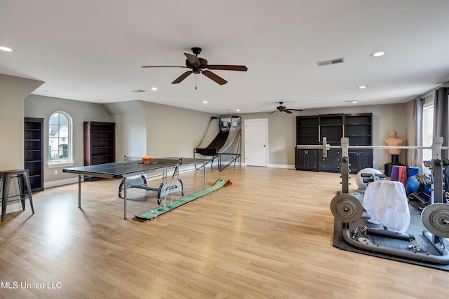 recreation room featuring healthy amount of natural light, wood finished floors, ceiling fan, recessed lighting, and baseboards