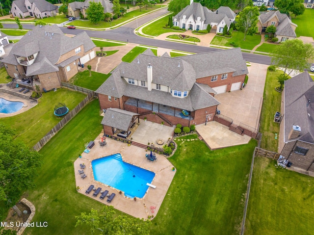 aerial view of residential area with a pool