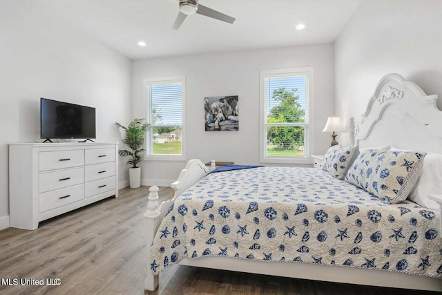 bedroom featuring ceiling fan and light hardwood / wood-style flooring