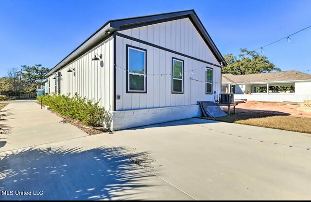 view of side of home featuring central air condition unit