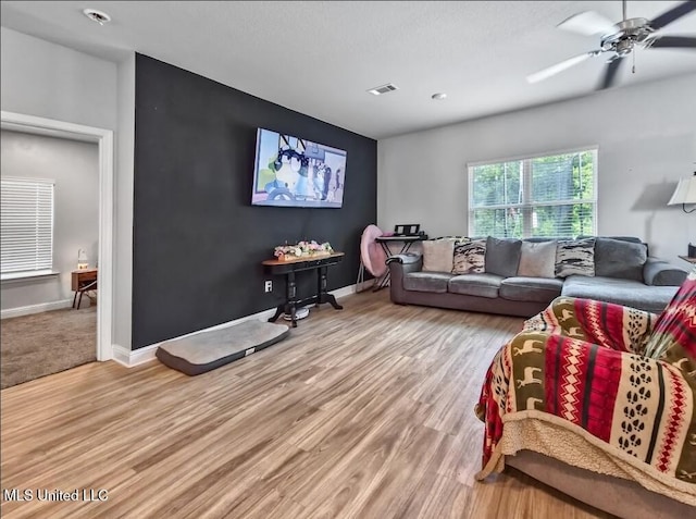 5065 Fairbury Way, Diberville, MS 39540 - living room with light wood finished floors, a ceiling fan, and baseboards