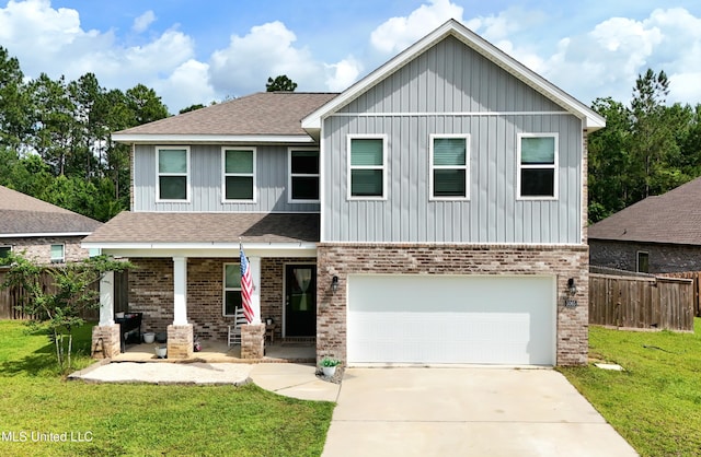5065 Fairbury Way, Diberville, MS 39540 - view of front of home with covered porch, board and batten siding, a garage, brick siding, and concrete driveway