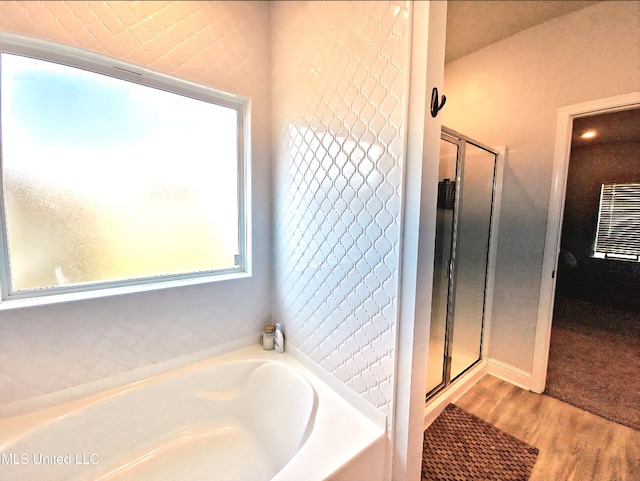 5065 Fairbury Way, Diberville, MS 39540 - bathroom with a garden tub, wood finished floors, and a stall shower