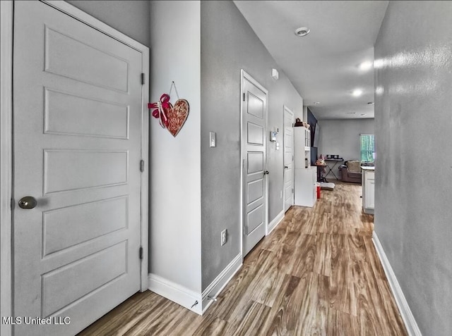 5065 Fairbury Way, Diberville, MS 39540 - hallway with wood finished floors and baseboards