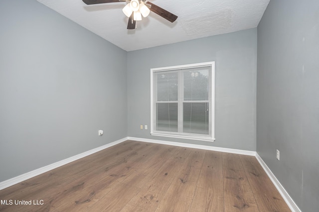 2204 Rue Beaux Chenes, Ocean Springs, MS 39564 - unfurnished room with a ceiling fan and wood-type flooring