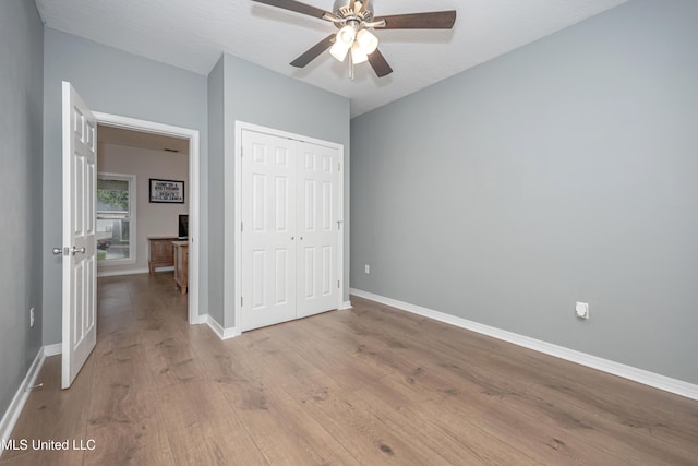 2204 Rue Beaux Chenes, Ocean Springs, MS 39564 - unfurnished bedroom with wood finished floors, a closet, an office area, and ceiling fan