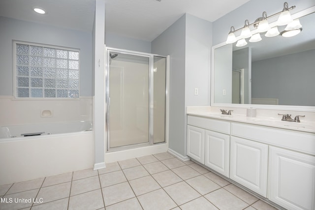 2204 Rue Beaux Chenes, Ocean Springs, MS 39564 - bathroom with a garden tub, a shower stall, double vanity, and tile patterned floors