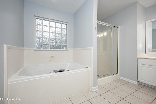 2204 Rue Beaux Chenes, Ocean Springs, MS 39564 - full bath with a stall shower, a bath, vanity, and tile patterned flooring