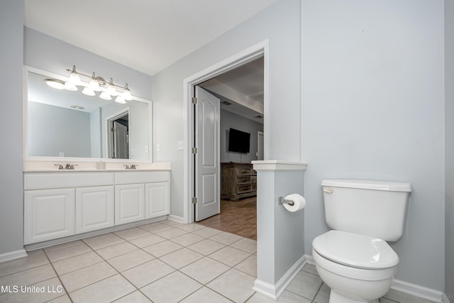 2204 Rue Beaux Chenes, Ocean Springs, MS 39564 - bathroom featuring double vanity and tile patterned floors