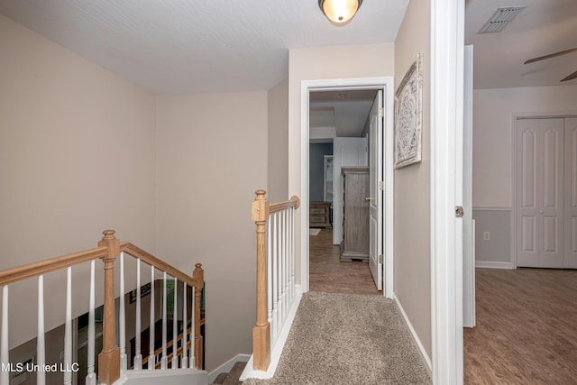 2204 Rue Beaux Chenes, Ocean Springs, MS 39564 - hallway with an upstairs landing and wood finished floors