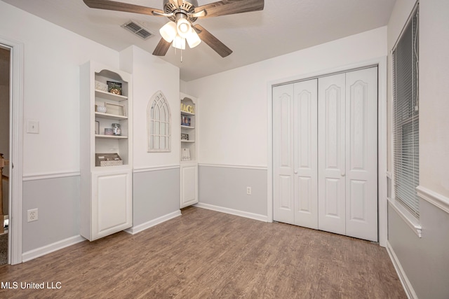 2204 Rue Beaux Chenes, Ocean Springs, MS 39564 - unfurnished bedroom featuring wood finished floors, a closet, and a ceiling fan