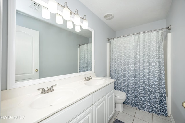 2204 Rue Beaux Chenes, Ocean Springs, MS 39564 - full bathroom with tile patterned floors and double vanity
