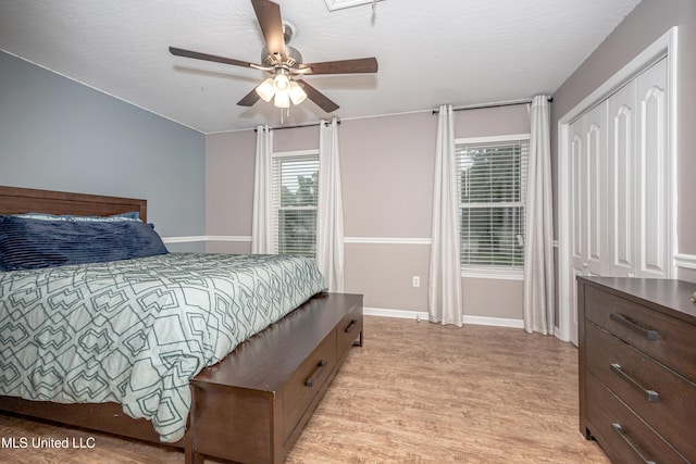2204 Rue Beaux Chenes, Ocean Springs, MS 39564 - bedroom with light wood-style flooring and ceiling fan