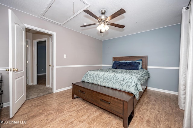 2204 Rue Beaux Chenes, Ocean Springs, MS 39564 - bedroom with light wood-style flooring and a ceiling fan