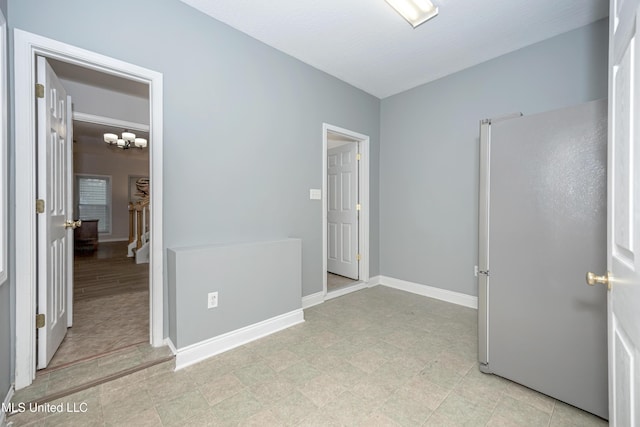 2204 Rue Beaux Chenes, Ocean Springs, MS 39564 - unfurnished bedroom with baseboards and freestanding refrigerator