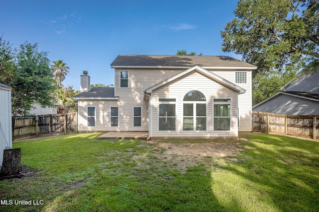 2204 Rue Beaux Chenes, Ocean Springs, MS 39564 - rear view of property with a fenced backyard, a patio area, and a chimney