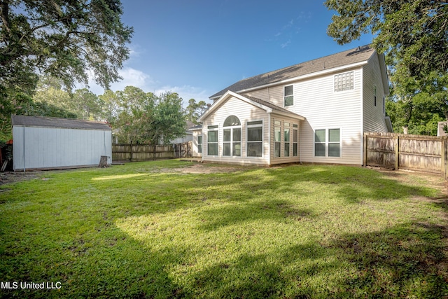2204 Rue Beaux Chenes, Ocean Springs, MS 39564 - back of property with a fenced backyard, a shed, and a sunroom