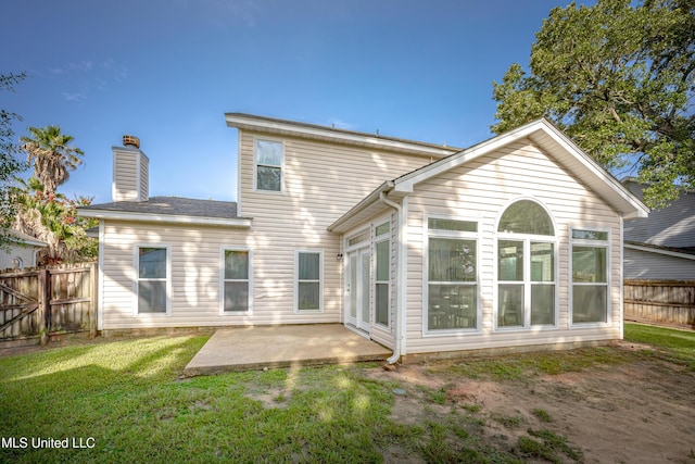 2204 Rue Beaux Chenes, Ocean Springs, MS 39564 - back of property featuring a patio area and a chimney