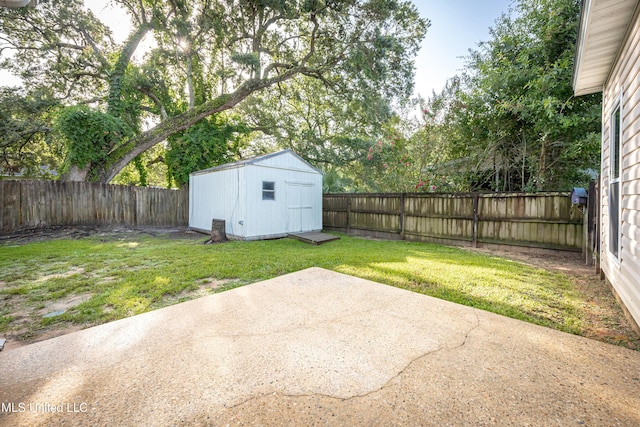 2204 Rue Beaux Chenes, Ocean Springs, MS 39564 - fenced backyard featuring a patio and a storage unit