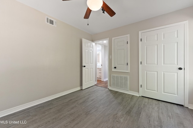 unfurnished bedroom featuring ceiling fan and wood-type flooring