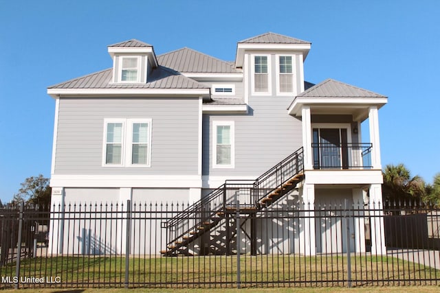 view of front of home with a garage and a front yard