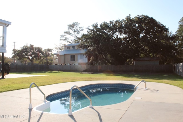 view of pool with a yard and a patio