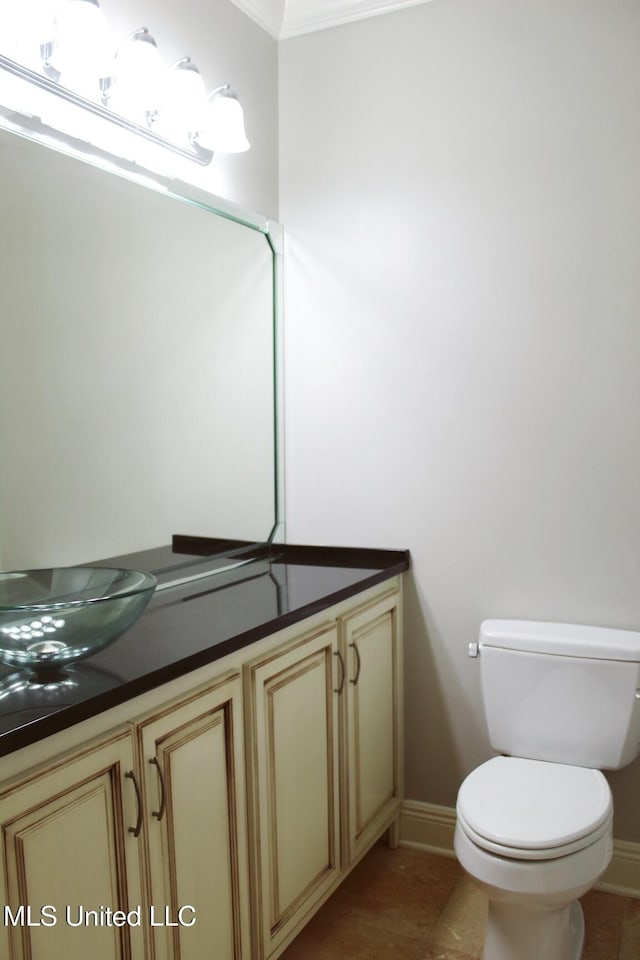 bathroom featuring tile patterned floors, vanity, and toilet