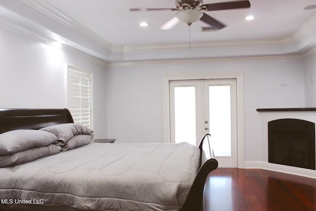 bedroom with hardwood / wood-style floors, access to outside, french doors, ceiling fan, and ornamental molding