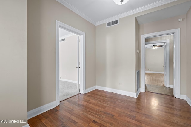 300 S 21st Ave, Hattiesburg, MS 39401 - spare room featuring wood finished floors, baseboards, crown molding, and ceiling fan