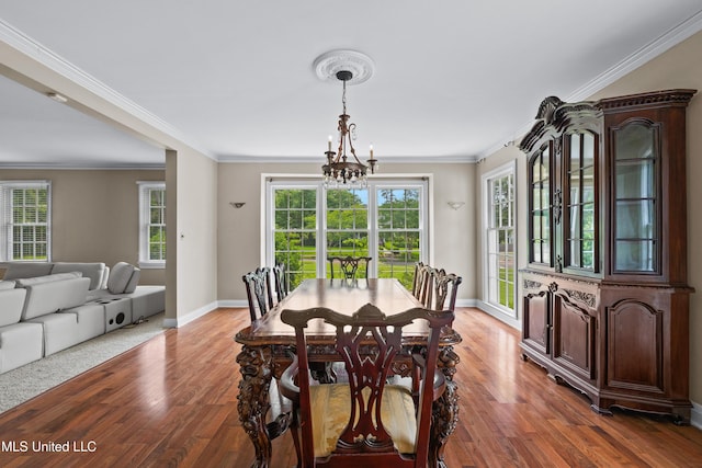 300 S 21st Ave, Hattiesburg, MS 39401 - dining space with a chandelier, light wood-style flooring, baseboards, healthy amount of natural light, and crown molding