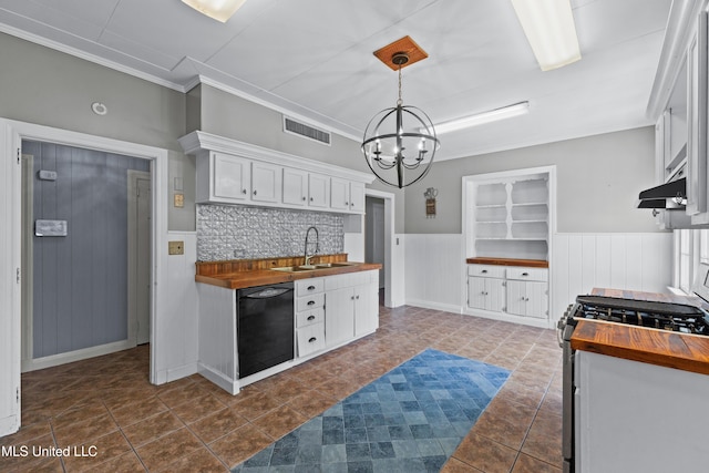 300 S 21st Ave, Hattiesburg, MS 39401 - kitchen with butcher block countertops, dishwasher, a sink, range with gas stovetop, and a wainscoted wall