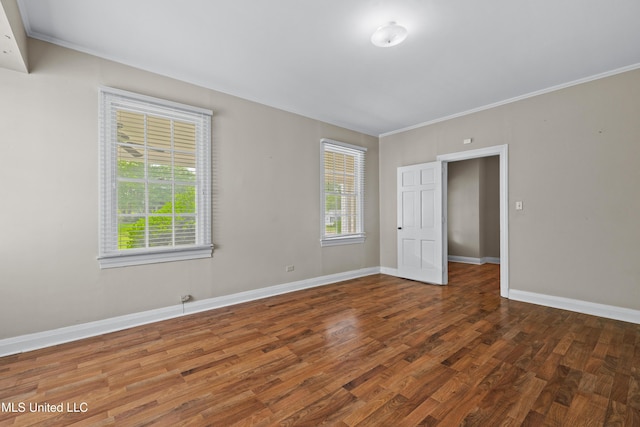 300 S 21st Ave, Hattiesburg, MS 39401 - empty room with wood finished floors, baseboards, and crown molding