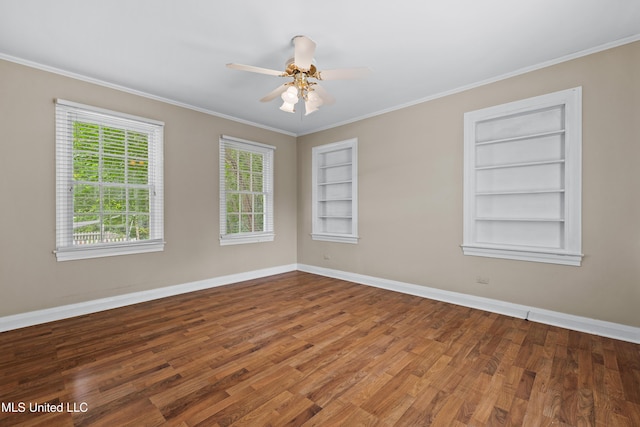 300 S 21st Ave, Hattiesburg, MS 39401 - empty room featuring built in shelves, baseboards, wood finished floors, crown molding, and a ceiling fan