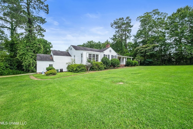 300 S 21st Ave, Hattiesburg, MS 39401 - view of front of property featuring a front lawn, a chimney, and an outbuilding
