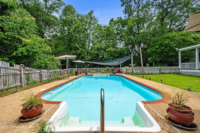 300 S 21st Ave, Hattiesburg, MS 39401 - view of swimming pool featuring view of wooded area and a patio