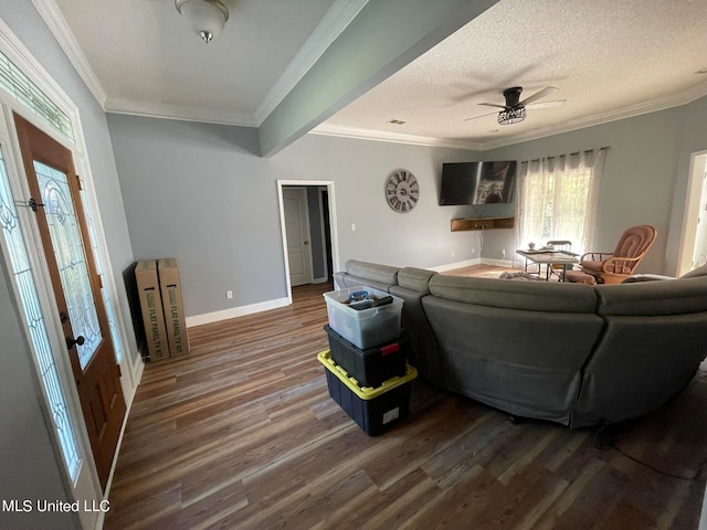 living room featuring ceiling fan, crown molding, dark wood-type flooring, a textured ceiling, and french doors