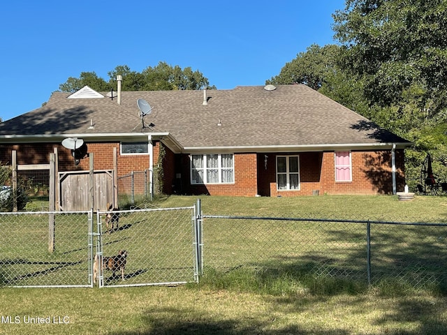 rear view of house with a lawn