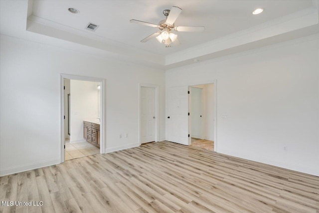 409 Sand Stone Pl, Brandon, MS 39042 - spare room featuring a raised ceiling, light wood finished floors, ceiling fan, recessed lighting, and crown molding